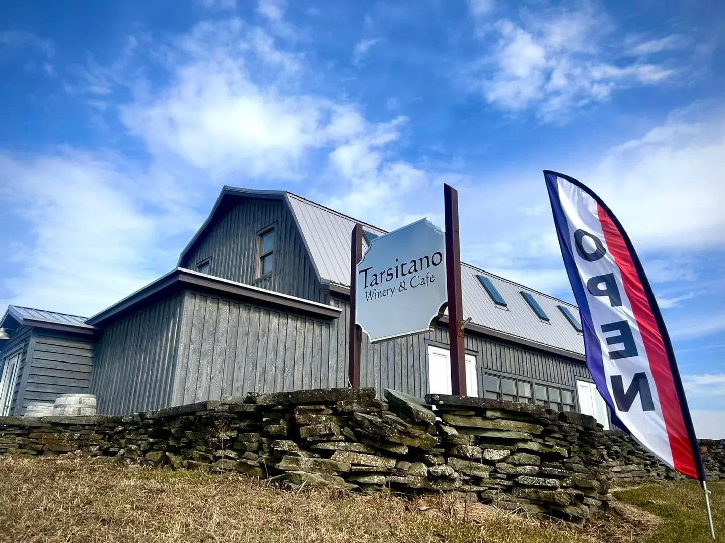 Building with inn sign, beckoning travelers to rest and relax.